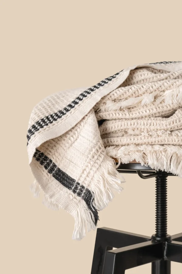 Plaid met wafelstructuur.